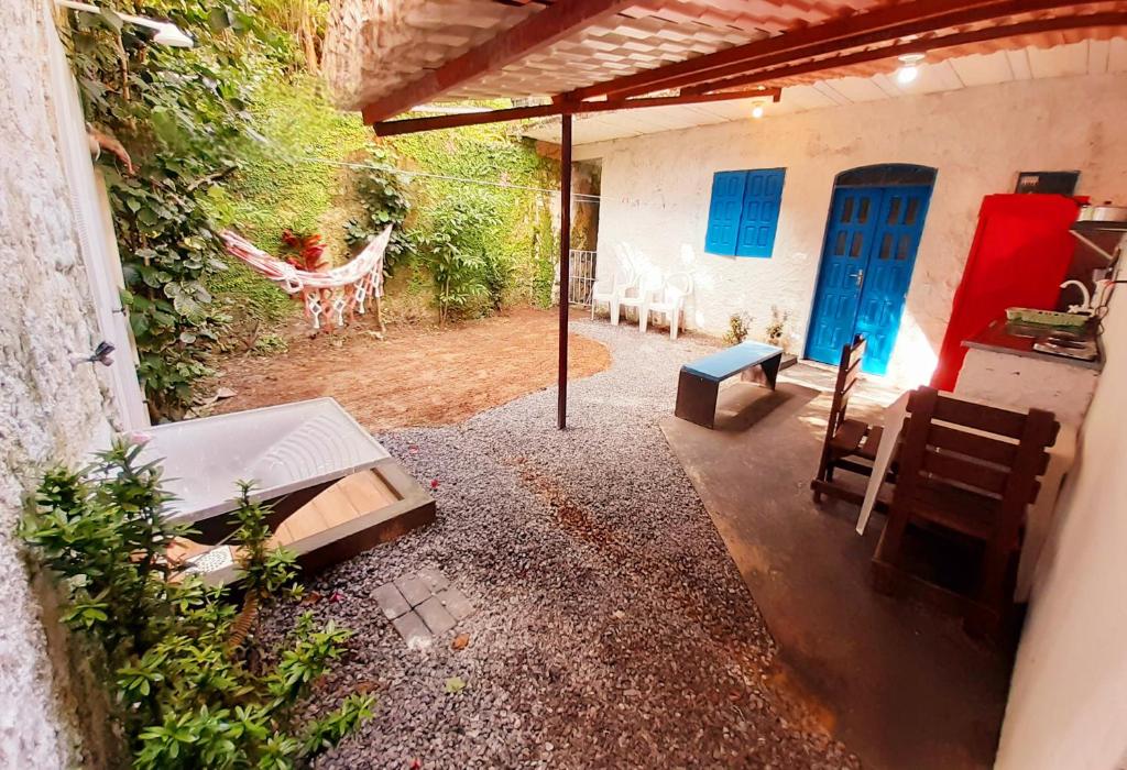 an outside view of a house with a patio at Casinha Guiné MorroSP in Morro de São Paulo