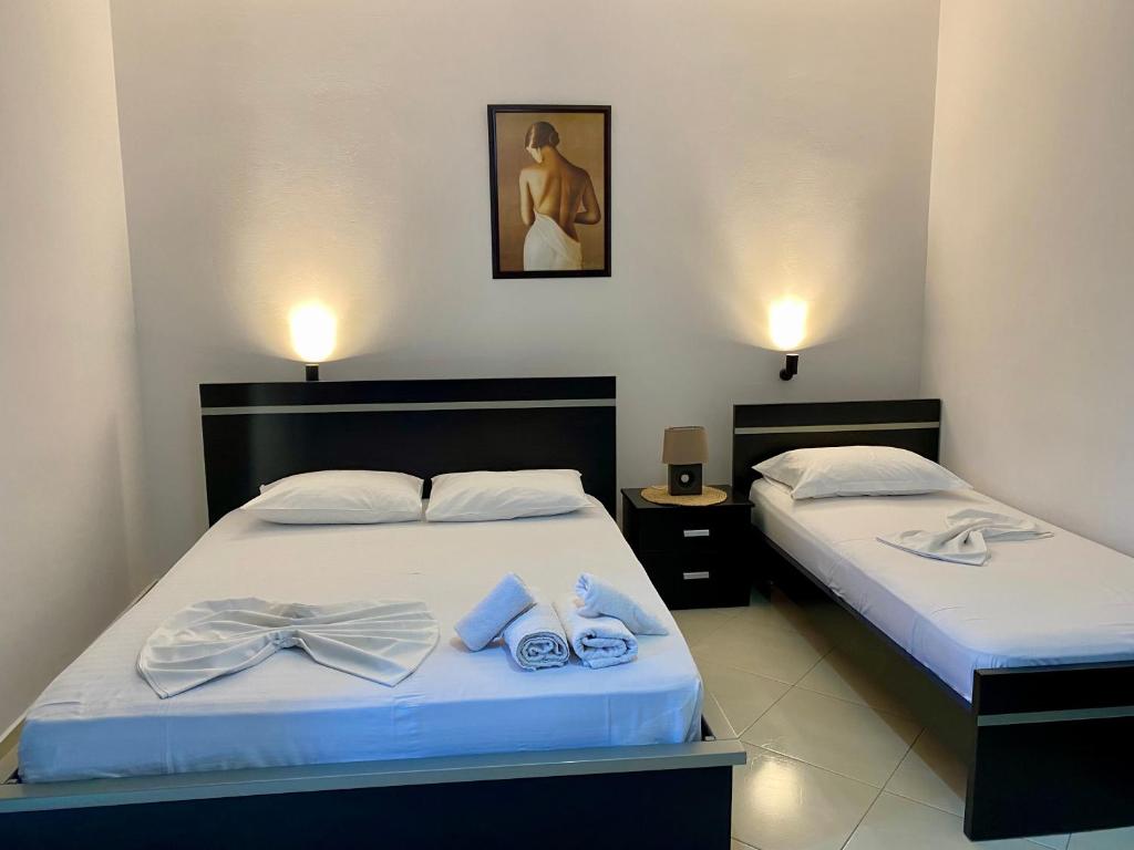 Postel nebo postele na pokoji v ubytování Hotel Metali