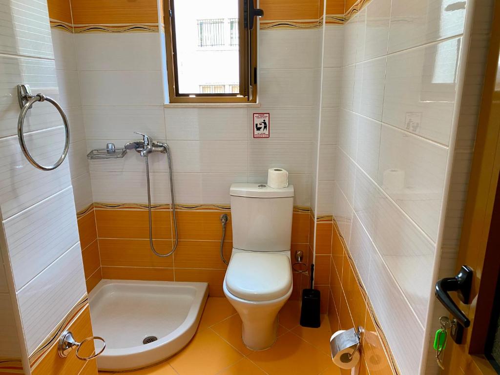 Koupelna v ubytování Hotel Metali