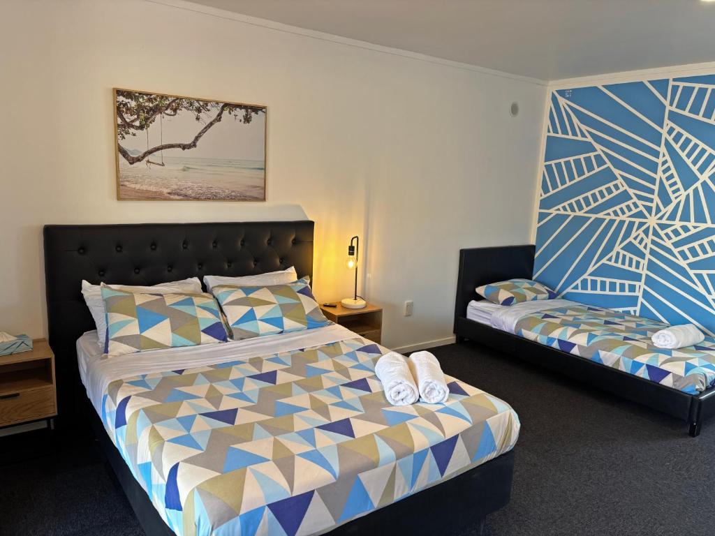 Letto o letti in una camera di Palm Tree Lodge