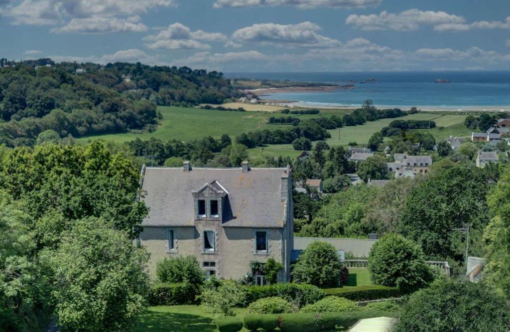 an aerial view of a house on a hill at BellevueBretagne - Chambres d'Hôtes in Saint-Jean-du-Doigt