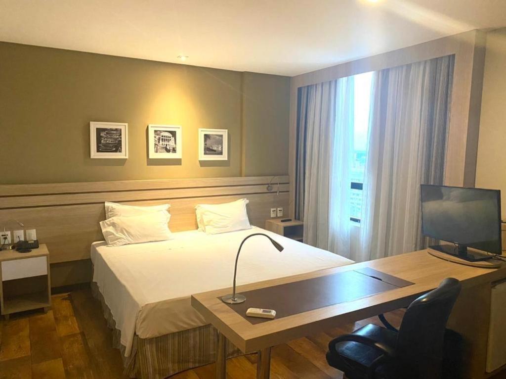Postel nebo postele na pokoji v ubytování APART HOTEL SENSE II - Localizado em Hotel