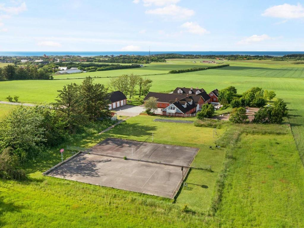 an aerial view of a house in a field at Charming Retreat in Lonstrup - By Traum Ferienwohnungen in Hjørring
