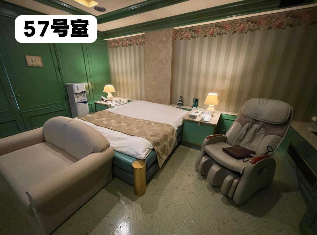Postel nebo postele na pokoji v ubytování 大人専用ホテルイエスタディ