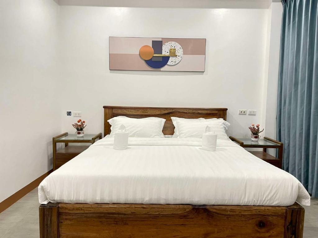 Postel nebo postele na pokoji v ubytování Ocean Star Hotel Coron