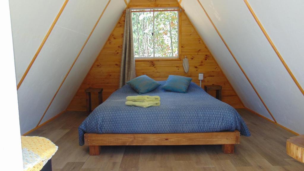 Postel nebo postele na pokoji v ubytování Glamping Eluney Bucalemu