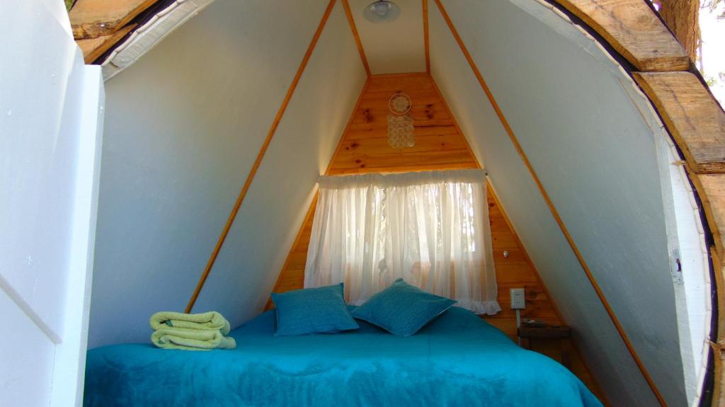 Postel nebo postele na pokoji v ubytování Glamping Eluney Bucalemu