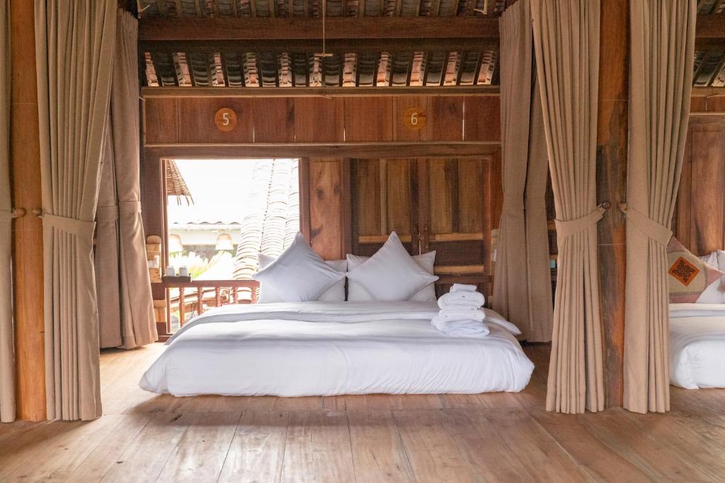 Giường trong phòng chung tại Anans Home Ha Giang - Tours &amp; Motorbike Rental