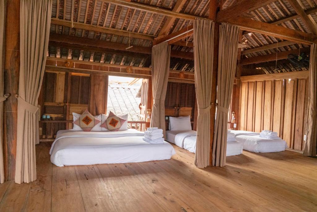 Giường trong phòng chung tại Anans Home Ha Giang - Tours &amp; Motorbike Rental