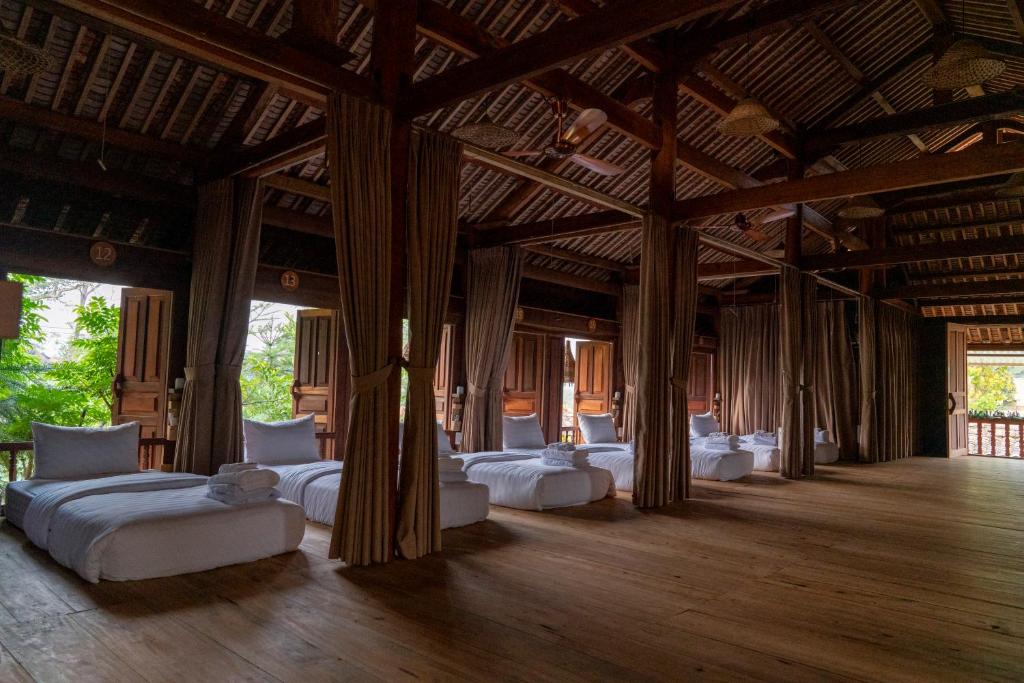 Giường trong phòng chung tại Anans Home Ha Giang - Tours &amp; Motorbike Rental
