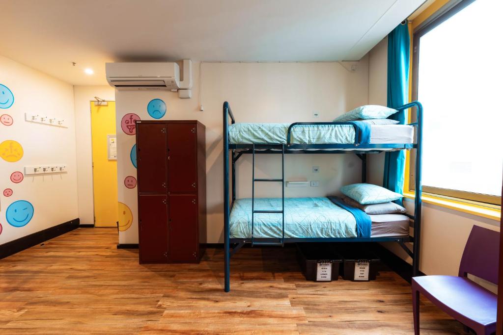 Postel nebo postele na pokoji v ubytování Flinders Backpackers