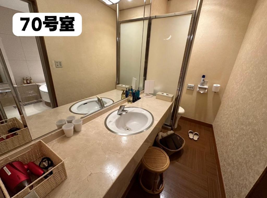 Koupelna v ubytování 大人専用ホテルイエスタディ