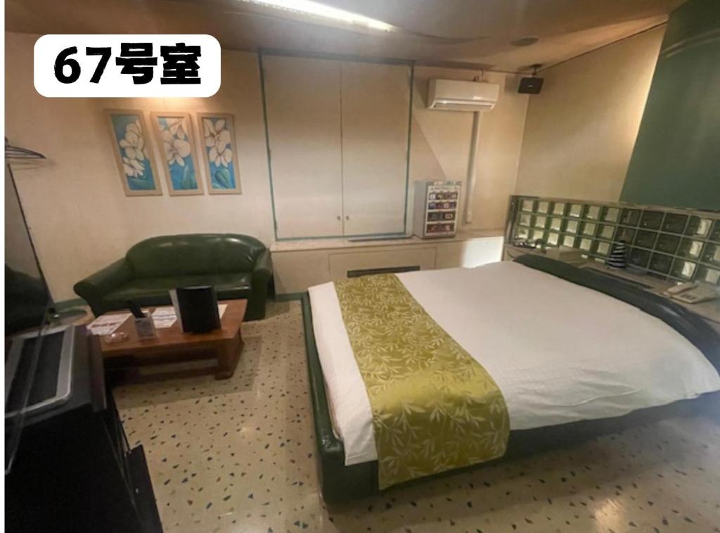 Postel nebo postele na pokoji v ubytování 大人専用ホテルイエスタディ