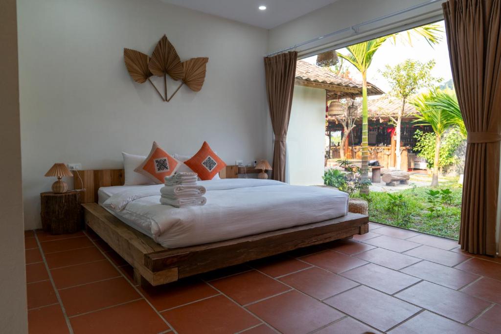 Giường trong phòng chung tại Anans Home Ha Giang - Tours &amp; Motorbike Rental