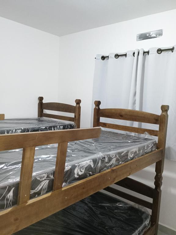 Ένα ή περισσότερα κρεβάτια σε δωμάτιο στο Casa de condomínio