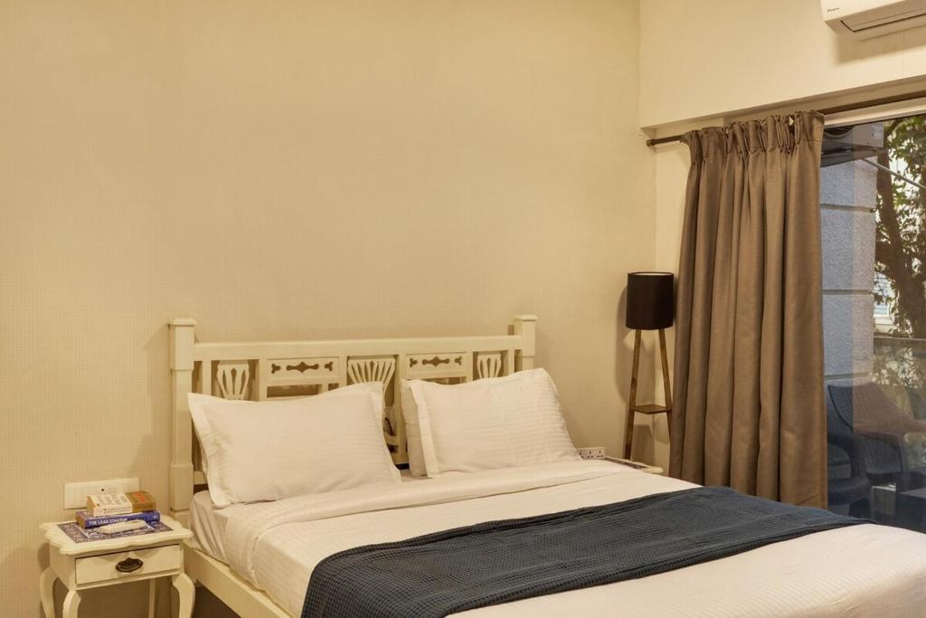 Ένα ή περισσότερα κρεβάτια σε δωμάτιο στο 1bhk in Siolim 5 mins -thalasa