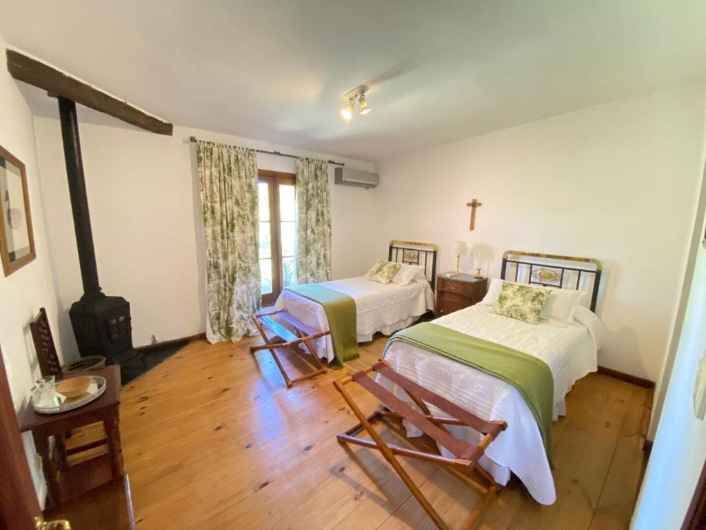 Postel nebo postele na pokoji v ubytování Las Vertientes hotel boutique