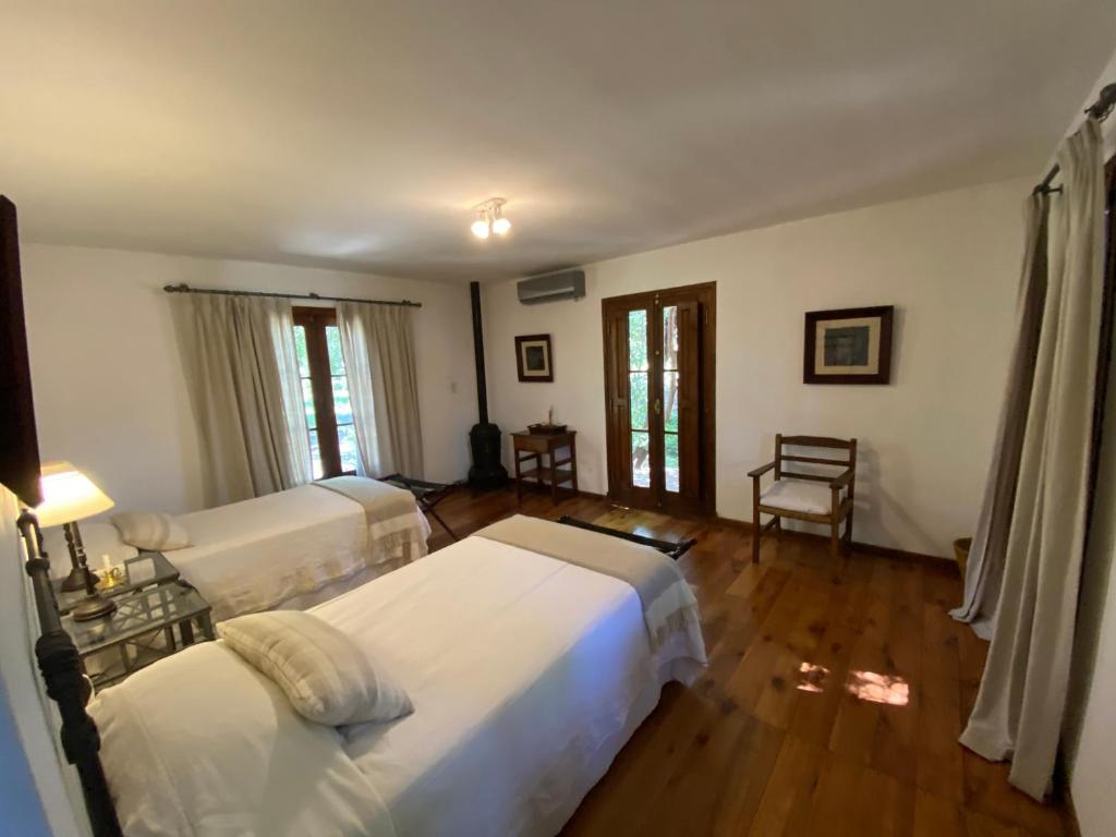 Postel nebo postele na pokoji v ubytování Las Vertientes hotel boutique