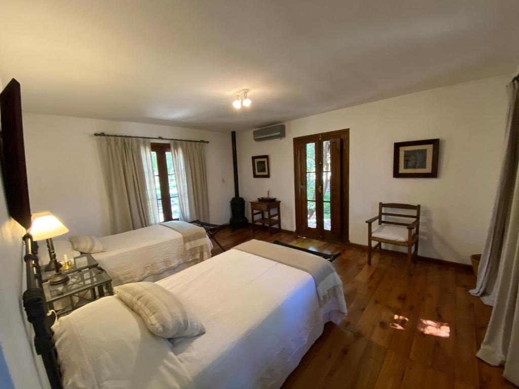 Postel nebo postele na pokoji v ubytování Las Vertientes hotel boutique
