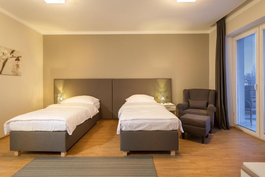 Postel nebo postele na pokoji v ubytování Apartmány Abacie