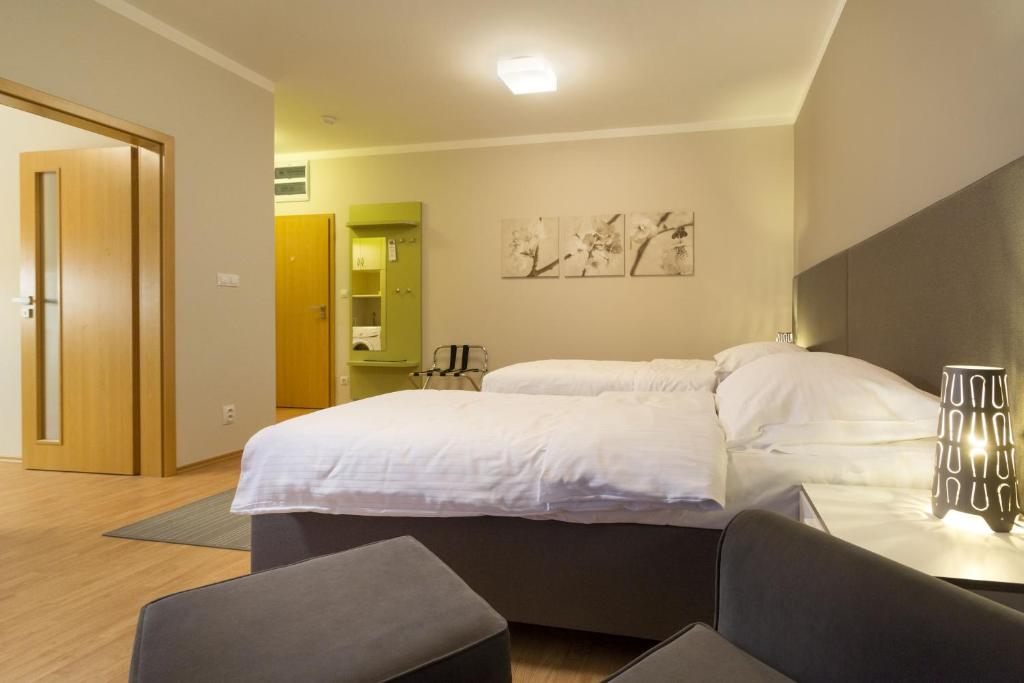 Postel nebo postele na pokoji v ubytování Apartmány Abacie