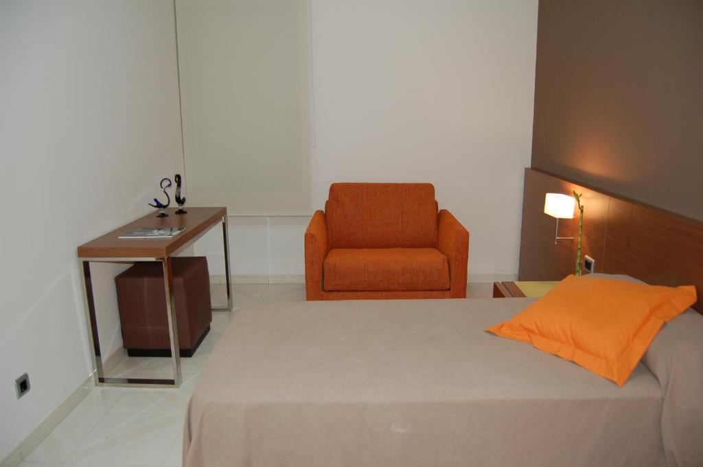 Postel nebo postele na pokoji v ubytování Hotel Diego