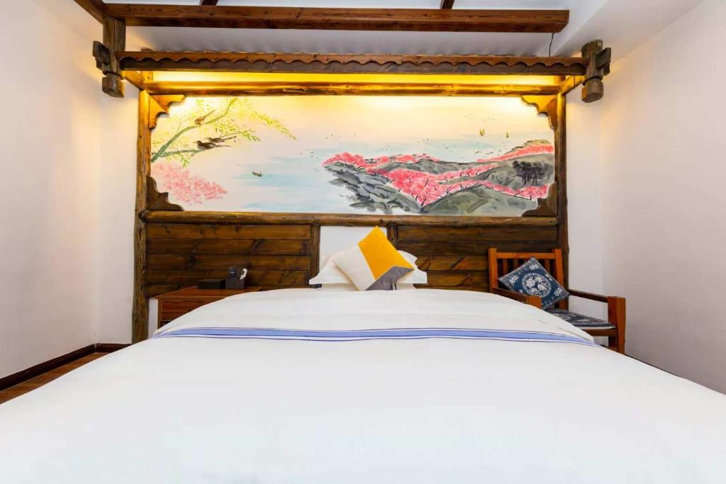 Postel nebo postele na pokoji v ubytování Hotel California Zhangjiajie