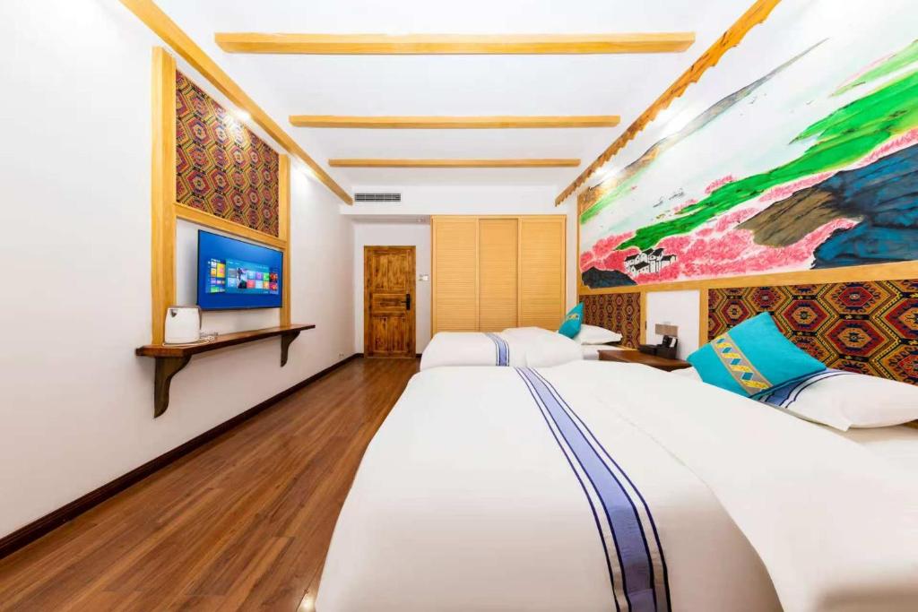 Postel nebo postele na pokoji v ubytování Hotel California Zhangjiajie