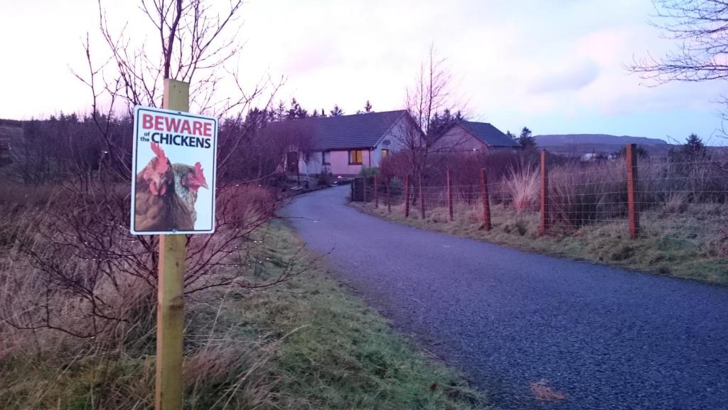 a sign is posted on the side of a road at B&B Kilcamb in Edinbane