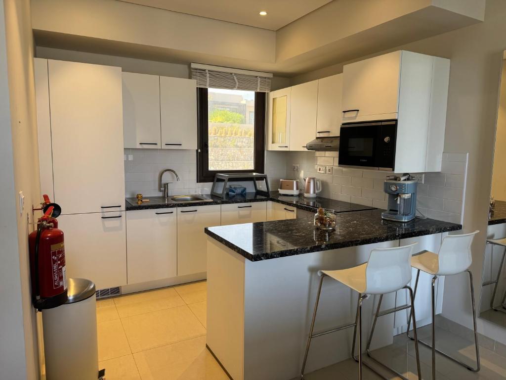 Kuchyň nebo kuchyňský kout v ubytování Beach house بيت البحر
