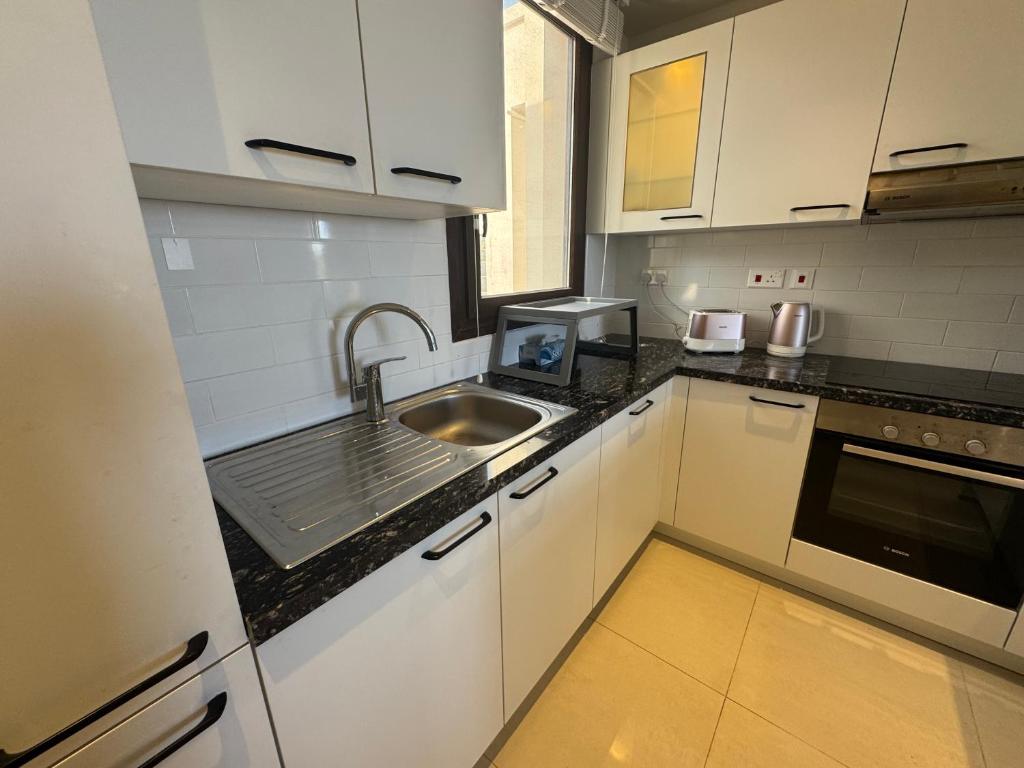 Kuchyň nebo kuchyňský kout v ubytování Beach house بيت البحر