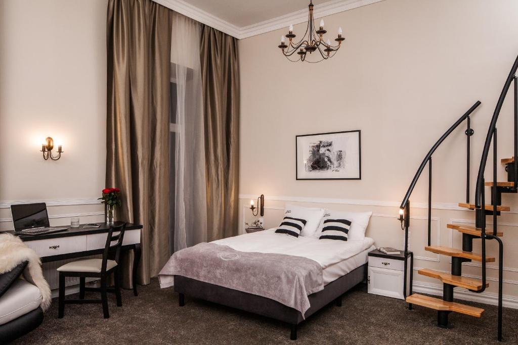 Posteľ alebo postele v izbe v ubytovaní Imagine Apartments