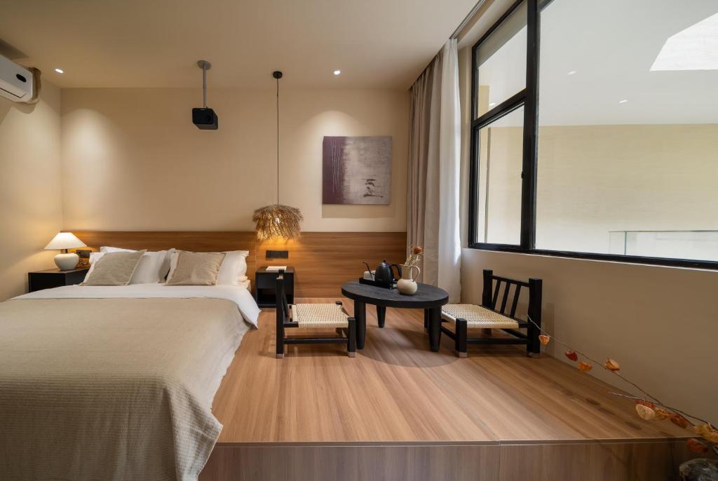 Postel nebo postele na pokoji v ubytování 厦门椿野酒店