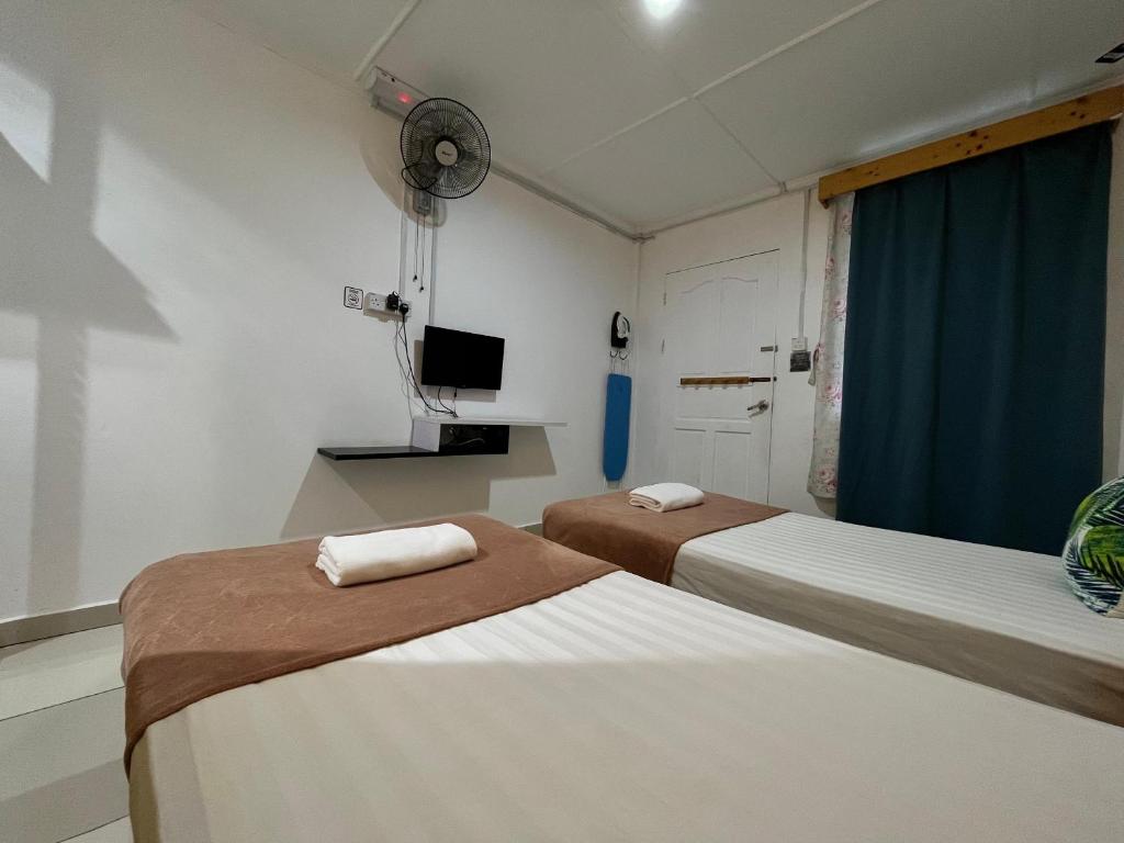 Postel nebo postele na pokoji v ubytování Bayu Senja Lodge