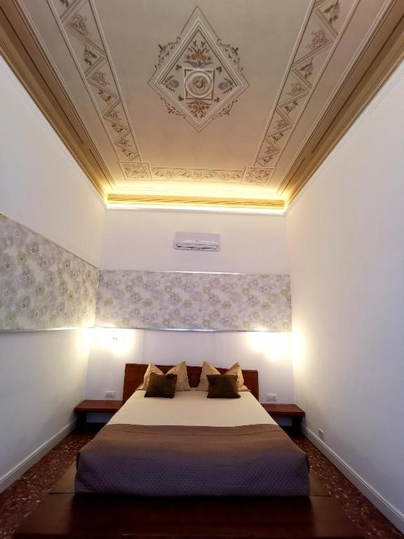 Postel nebo postele na pokoji v ubytování Tiritù Apartments