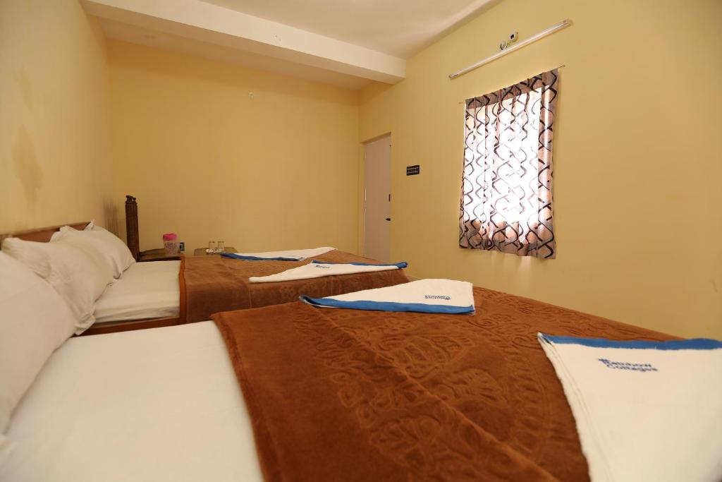 Postel nebo postele na pokoji v ubytování Rainbow Cottages-Budget Friendly rooms