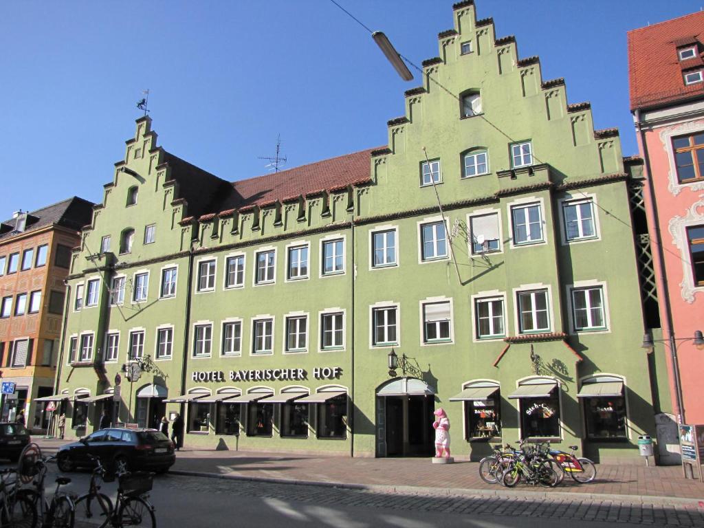 a large green building on the side of a street at Bayerischer Hof in Freising