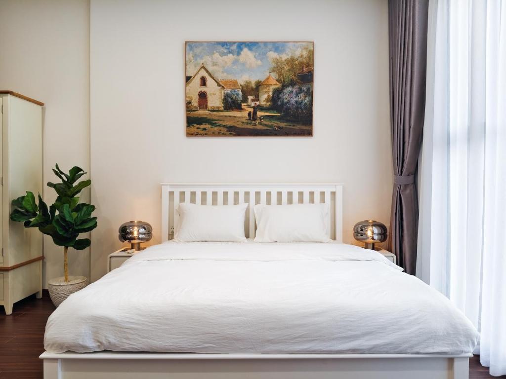 Ένα ή περισσότερα κρεβάτια σε δωμάτιο στο Giardini Guest House - Masteri WF - H302 - Ocean Park