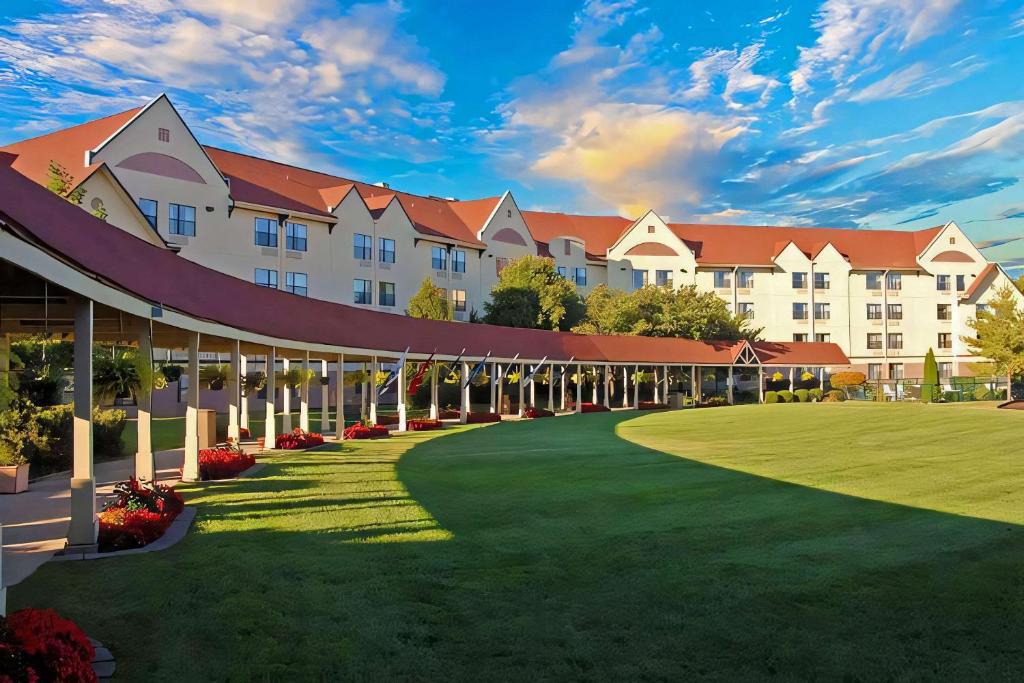 a rendering of a resort with a large building at Branson Hillside Hotel in Branson