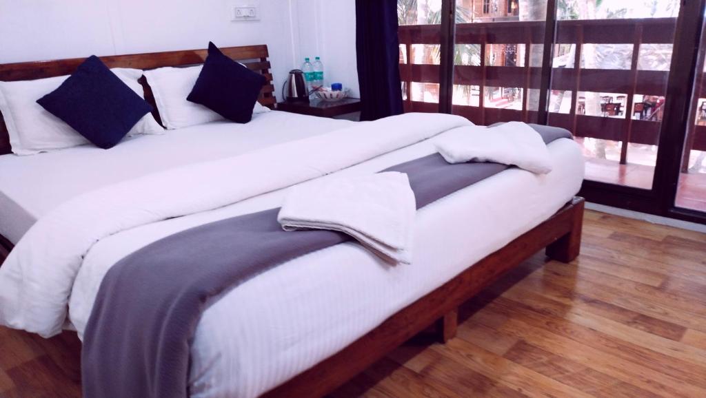 Postel nebo postele na pokoji v ubytování Samant Beach Resort