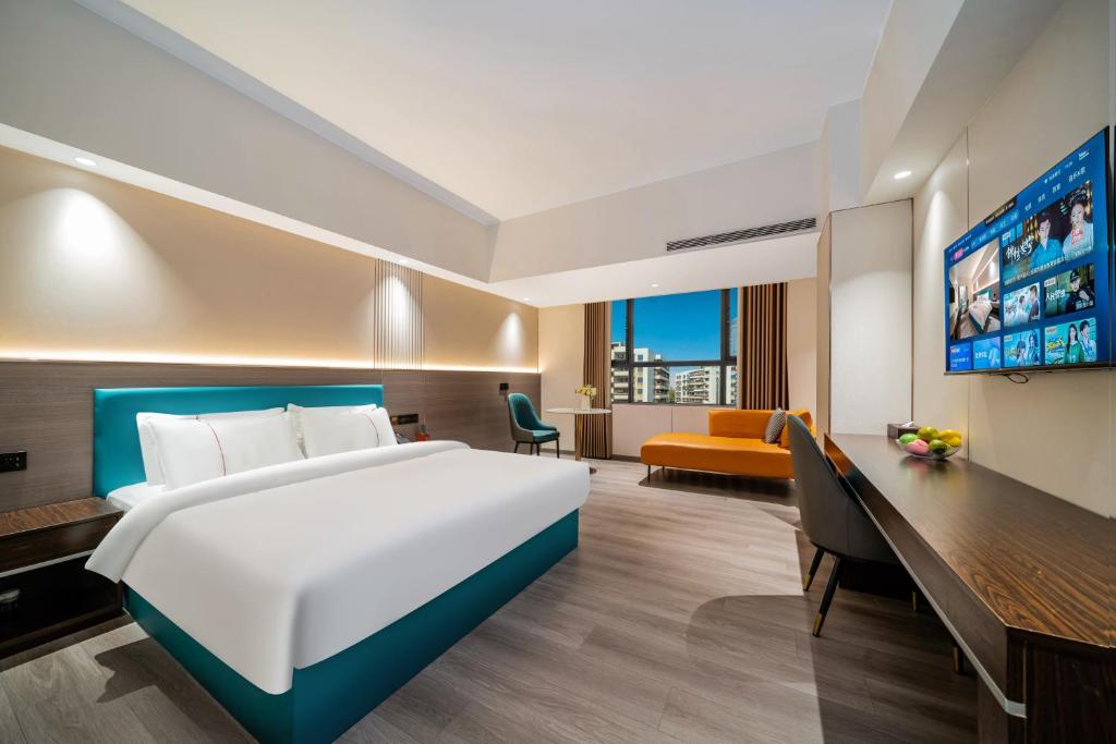 TV a/nebo společenská místnost v ubytování Mei Gang Hotel