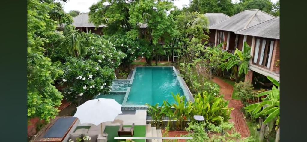 an overhead view of a swimming pool in a resort at BaanSuk Sukhothai Resort in Sukhothai