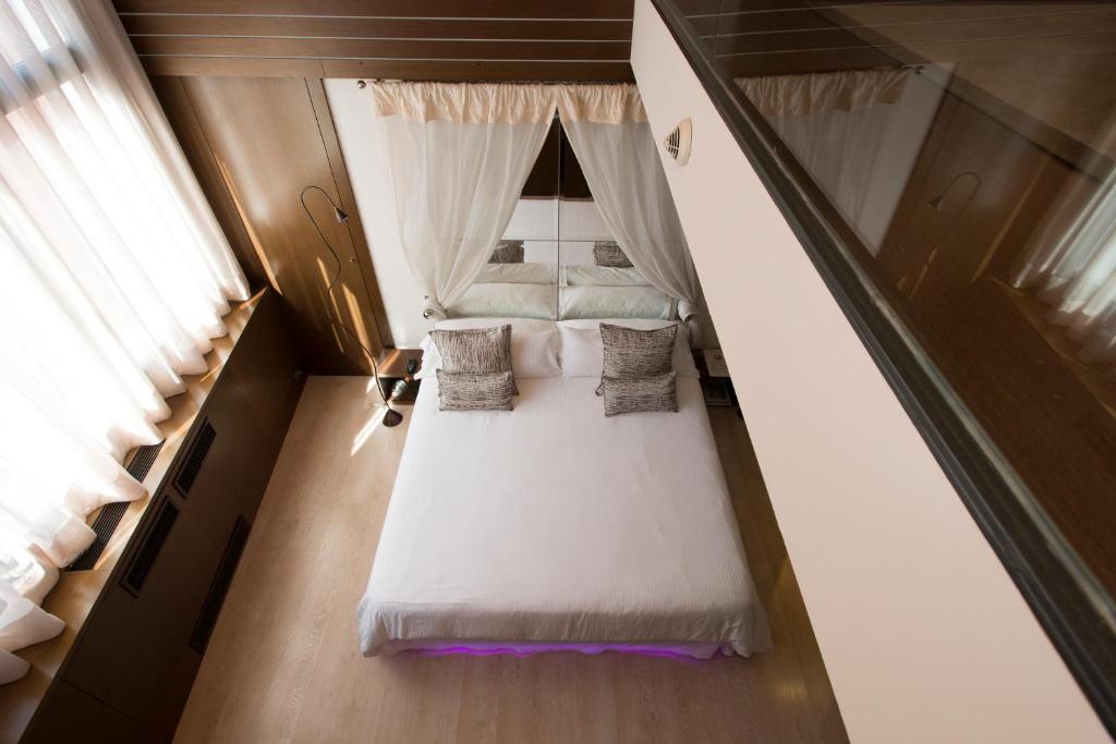 Postel nebo postele na pokoji v ubytování Hotel Museu Llegendes de Girona