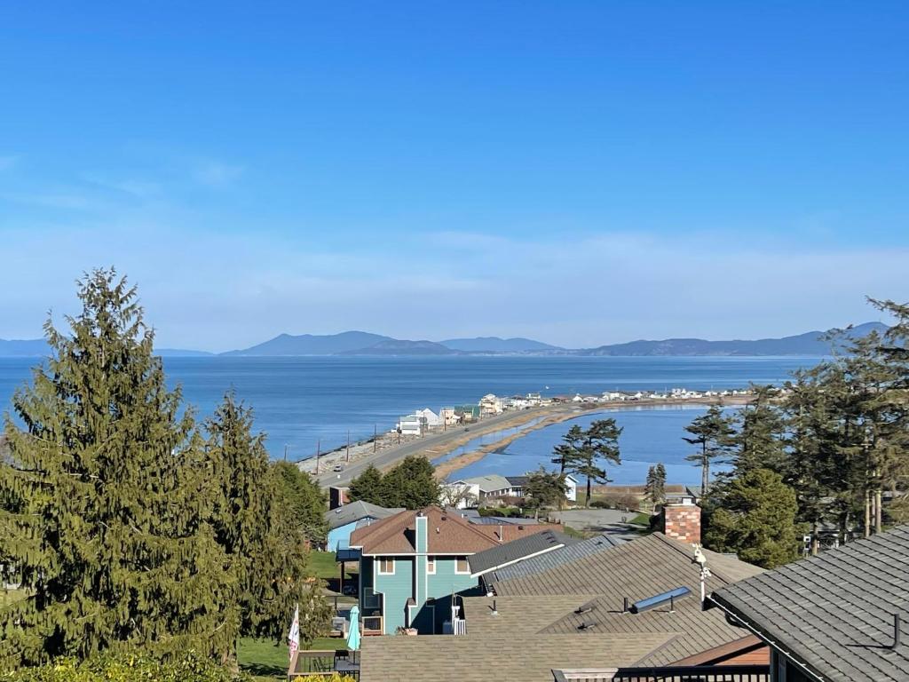 a view of a beach with houses and the ocean at Perch - Seascape Summit in Oak Harbor