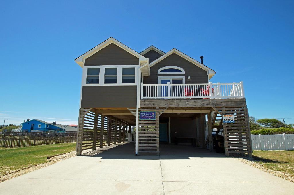 a house with a staircase leading up to it at KH4112-Resting Beach Face in Kitty Hawk