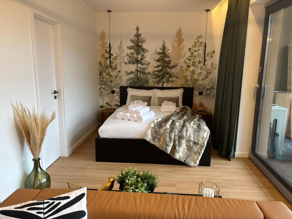 Postel nebo postele na pokoji v ubytování Hello Pilis Apartments