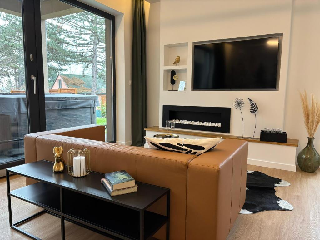 TV a/nebo společenská místnost v ubytování Hello Pilis Apartments