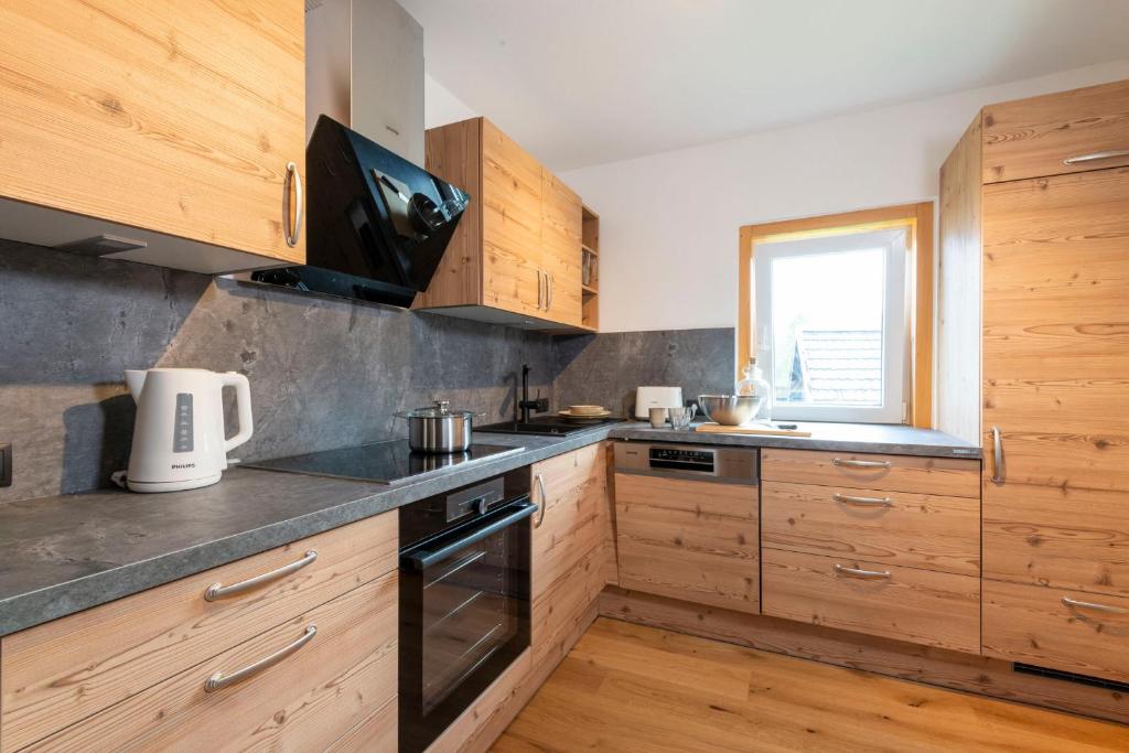 Kuchyň nebo kuchyňský kout v ubytování Apartments Sopherl - by myNests