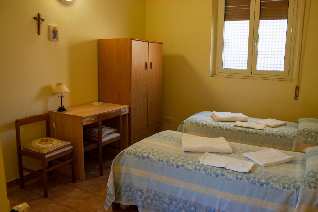 Postel nebo postele na pokoji v ubytování Casa per ferie Maria Ausiliatrice