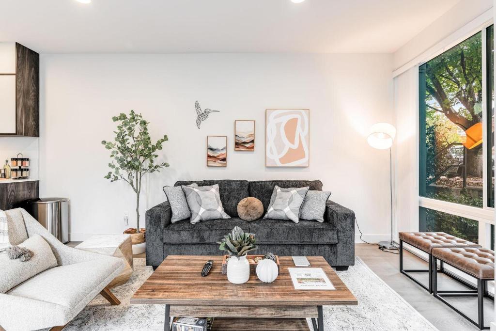 a living room with a couch and a table at Perch - View on Franklin in Seattle